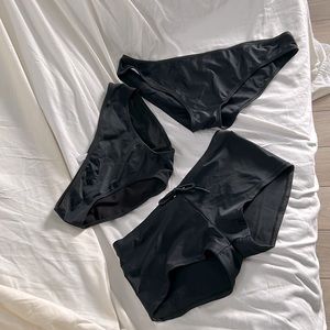 Swimsuit, bottoms, one boy short style, and two bikini bottoms. Black size L/XL.
